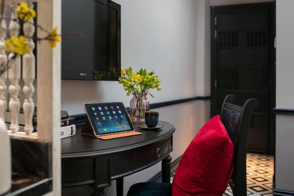 TV a/nebo společenská místnost v ubytování La Beaute Boutique Hotel & Spa