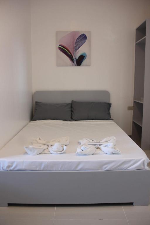 Postel nebo postele na pokoji v ubytování Bulusan Tourist Inn