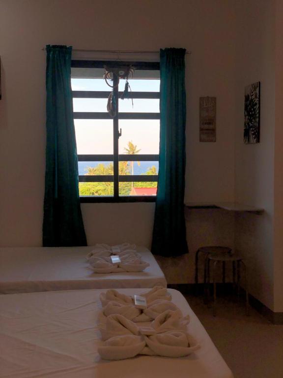 Postel nebo postele na pokoji v ubytování Bulusan Tourist Inn