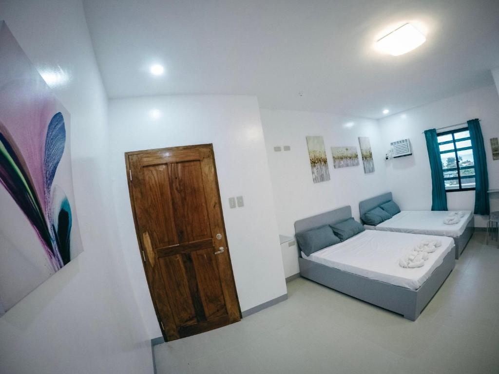 Postel nebo postele na pokoji v ubytování Bulusan Tourist Inn