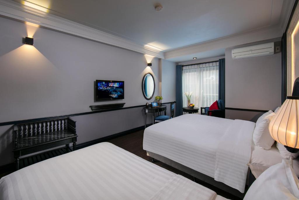 Postel nebo postele na pokoji v ubytování La Beaute Boutique Hotel & Spa