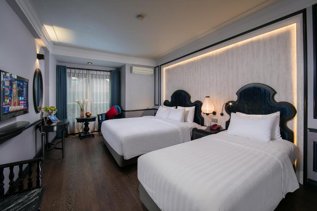 Postel nebo postele na pokoji v ubytování La Beaute Boutique Hotel & Spa