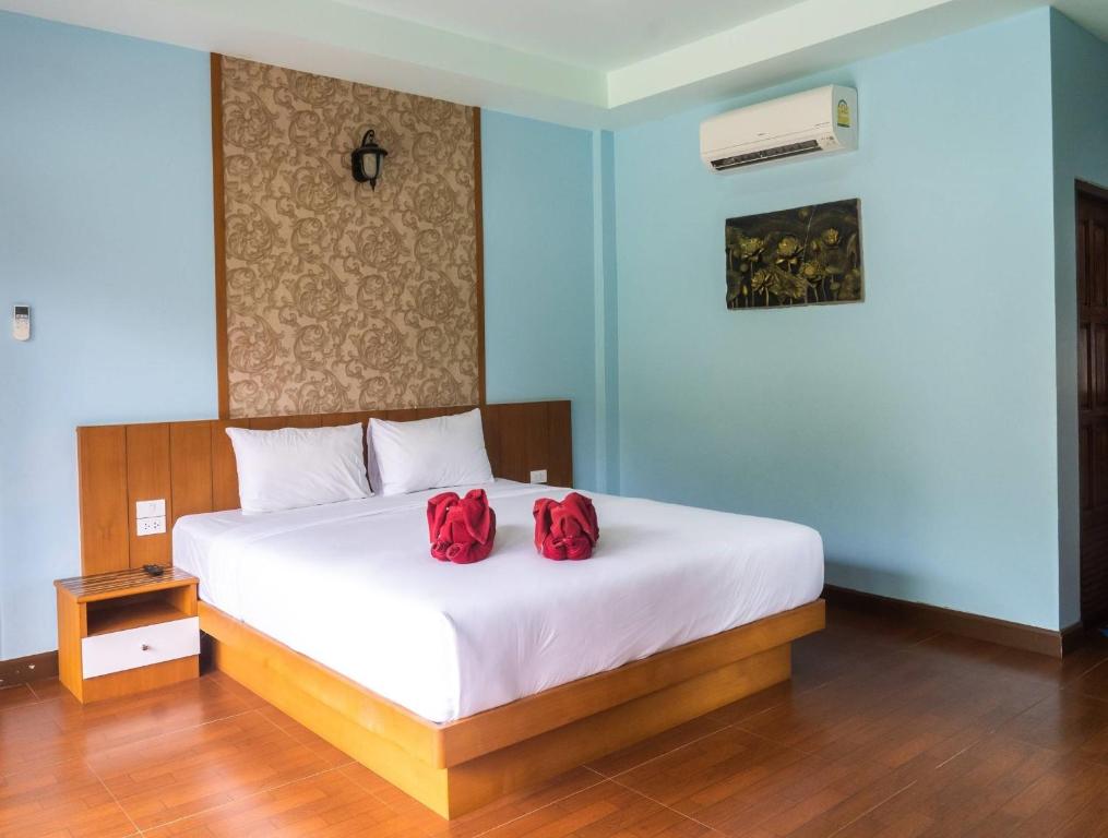 Postel nebo postele na pokoji v ubytování Chomview Resort