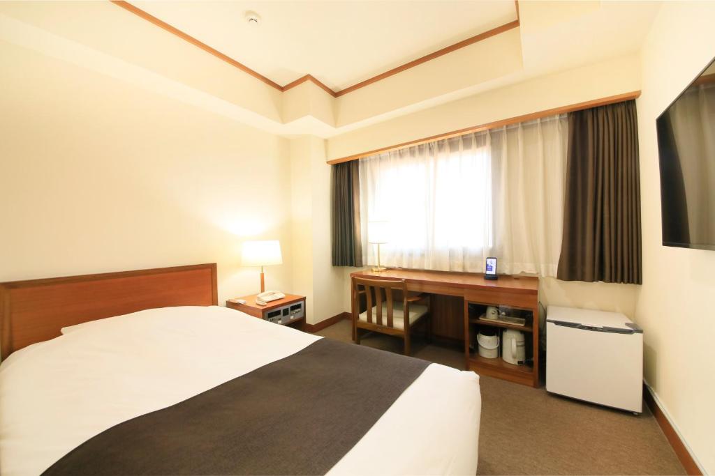 Postel nebo postele na pokoji v ubytování Maple Inn Makuhari