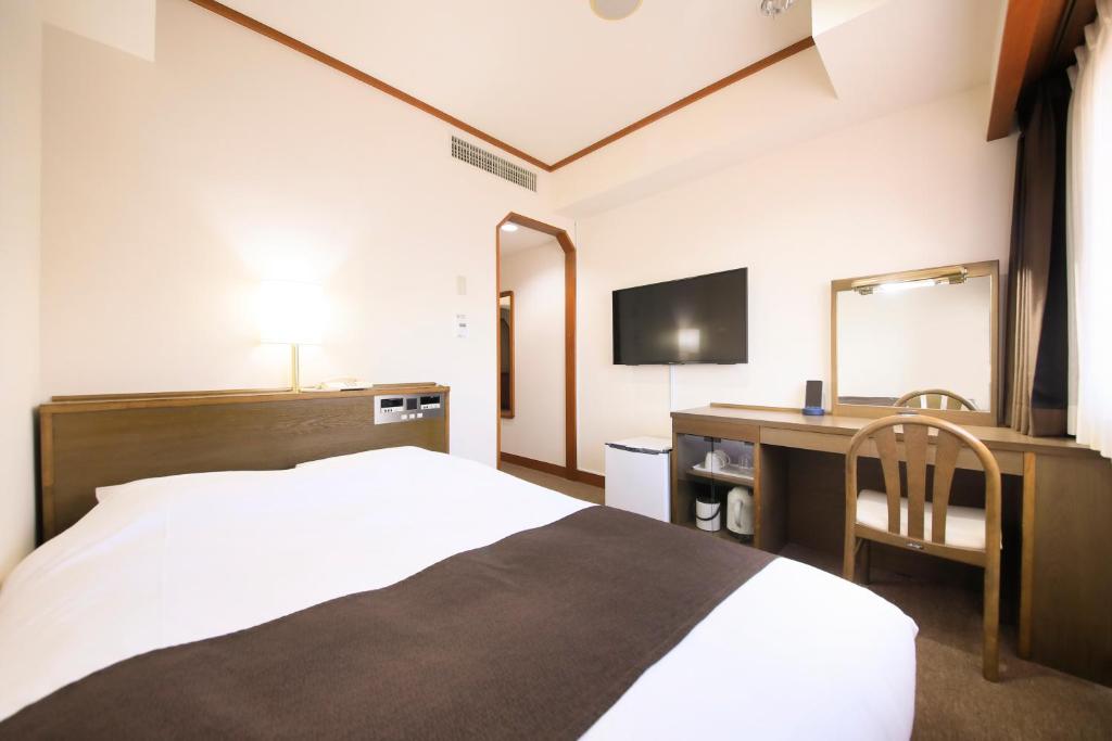 Postel nebo postele na pokoji v ubytování Maple Inn Makuhari