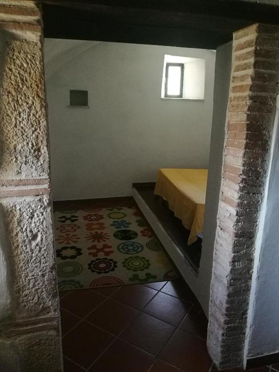 A bed or beds in a room at La Rocchetta