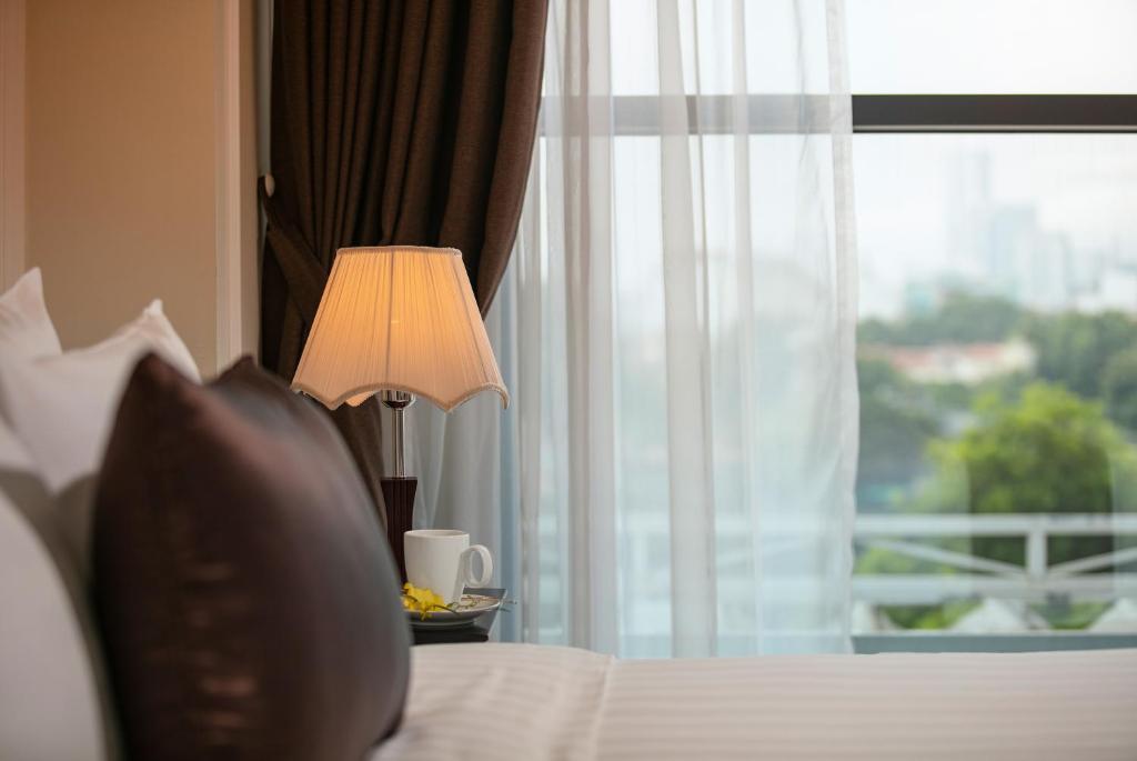 Postel nebo postele na pokoji v ubytování Adonis Hotel