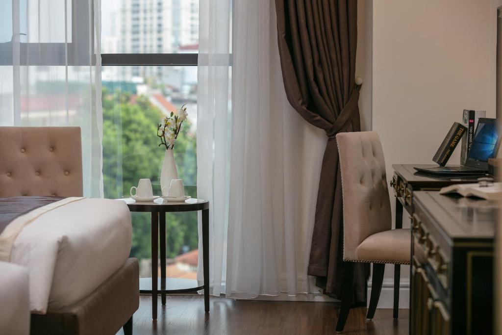 Postel nebo postele na pokoji v ubytování Adonis Hotel