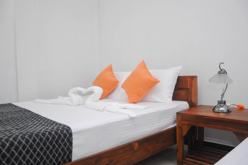 Postel nebo postele na pokoji v ubytování Restwell Homestay