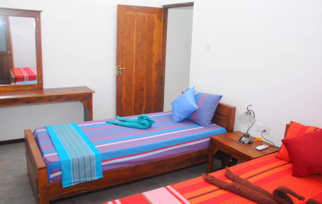 Postel nebo postele na pokoji v ubytování Restwell Homestay
