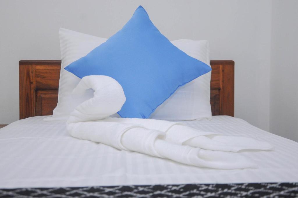 Postel nebo postele na pokoji v ubytování Restwell Homestay