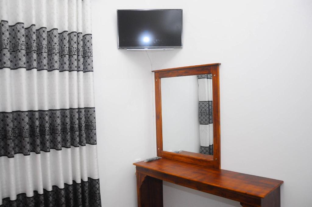 TV a/nebo společenská místnost v ubytování Restwell Homestay