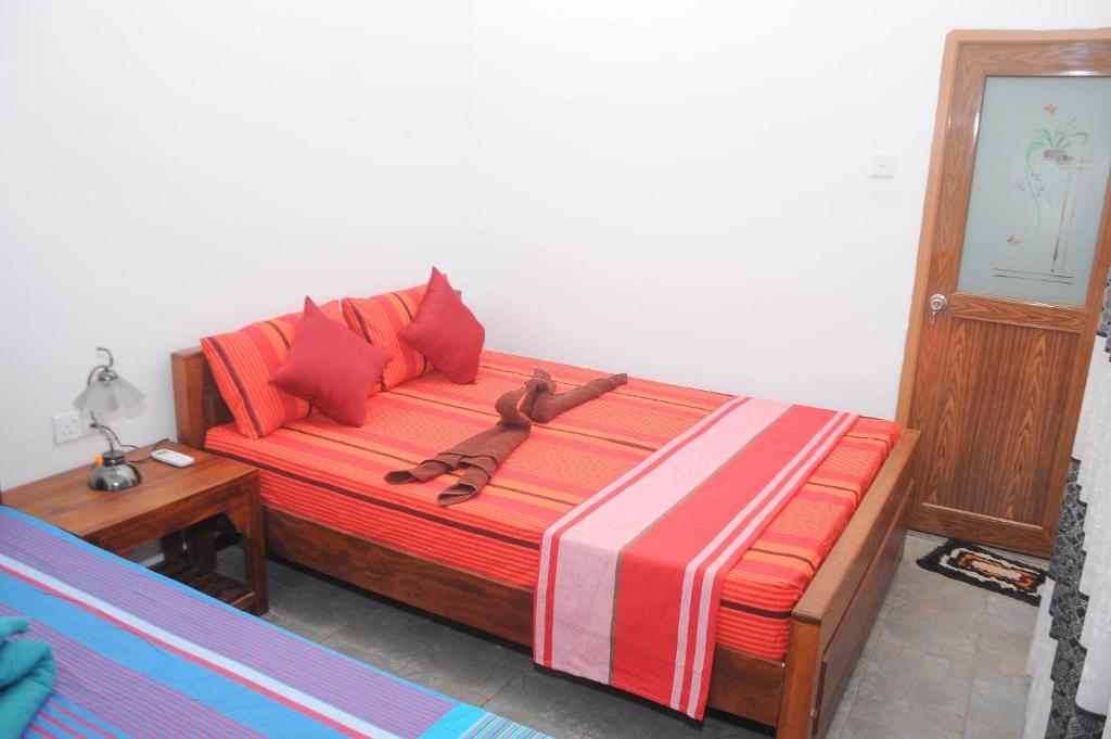 Postel nebo postele na pokoji v ubytování Restwell Homestay