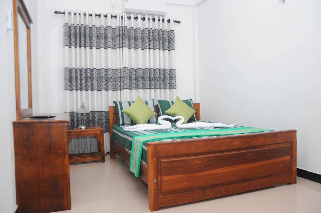 Postel nebo postele na pokoji v ubytování Restwell Homestay