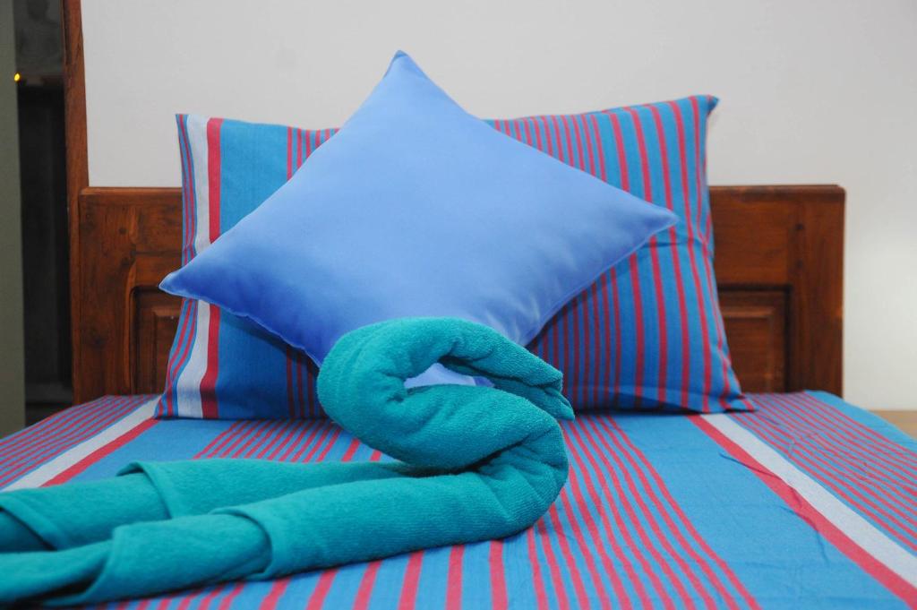 Postel nebo postele na pokoji v ubytování Restwell Homestay