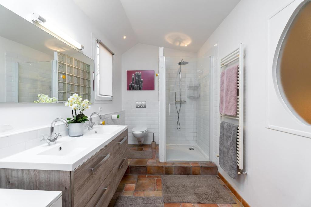 a bathroom with a shower and a sink and a toilet at My rima in Antibes