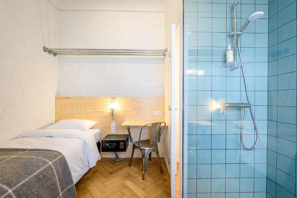 Postel nebo postele na pokoji v ubytování Hotel La Grande Cloche