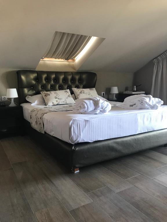 Postel nebo postele na pokoji v ubytování Principal New Leisure Hotel