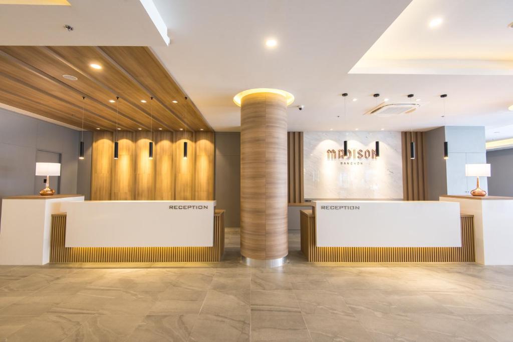 A symmetrical view of Madison Bangkok’s twin reception desks.