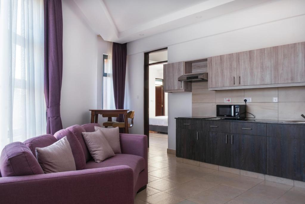 Kuchyň nebo kuchyňský kout v ubytování L'Aziz Suites