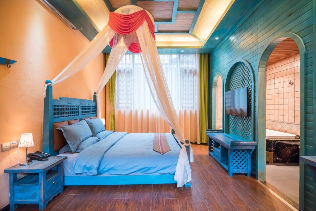 Postel nebo postele na pokoji v ubytování The Ritz-Man Boutique Inn Lijiang
