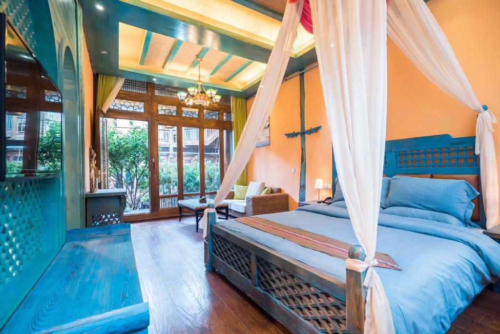 Postel nebo postele na pokoji v ubytování The Ritz-Man Boutique Inn Lijiang
