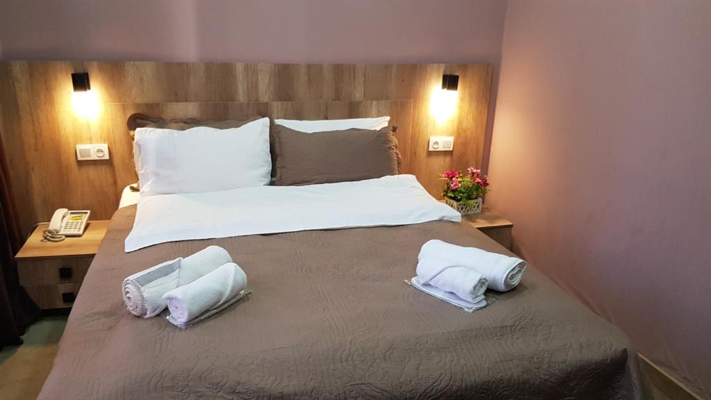 Postel nebo postele na pokoji v ubytování Epic Meidan Hotel
