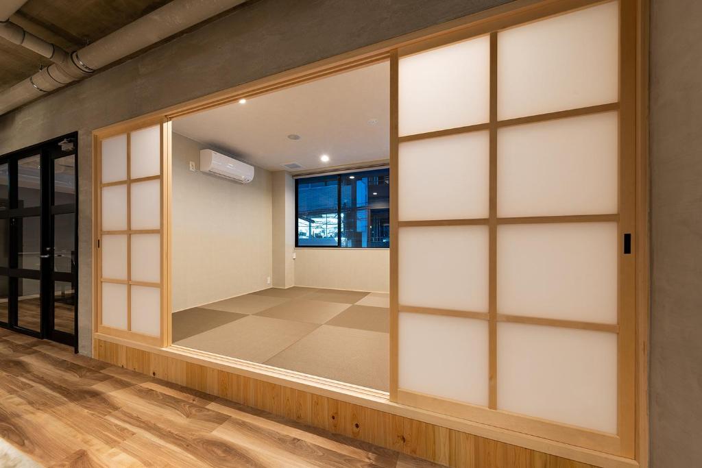 Postel nebo postele na pokoji v ubytování Hotel Morning Box Osaka Shinsaibashi