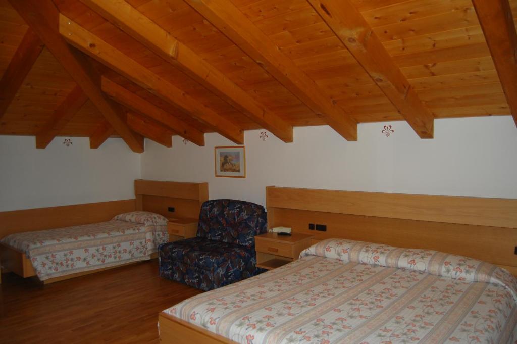 Postel nebo postele na pokoji v ubytování Garni Castel Ferari
