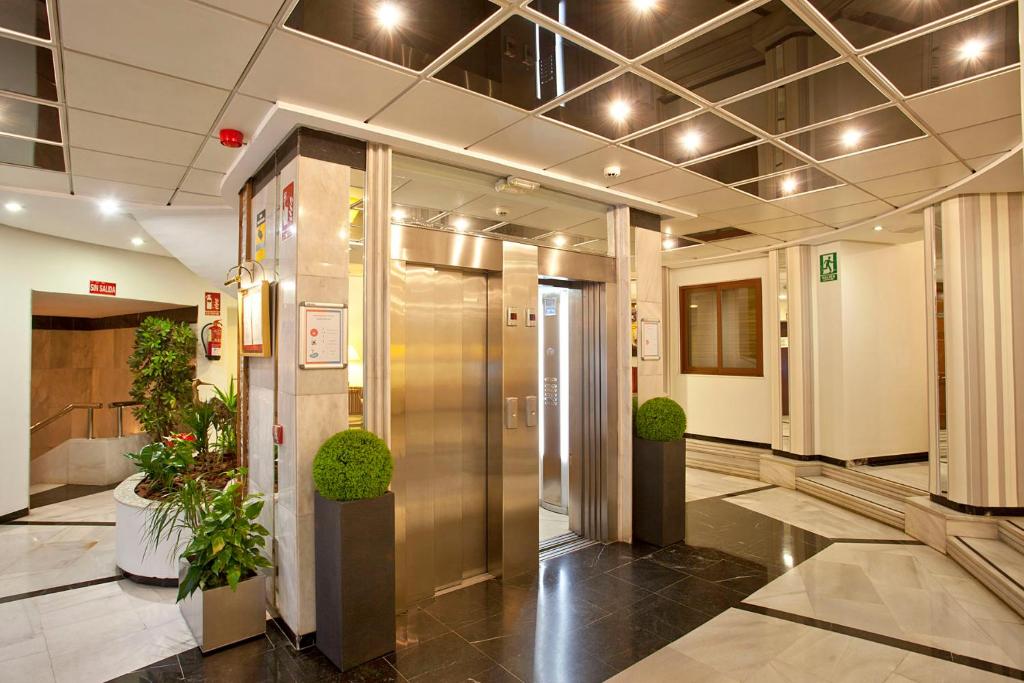 a lobby with a elevator in a building at Ona Princesa Playa in Marbella