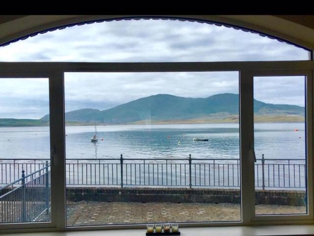 a view of the water from a window at Seaview Reenellen in Valentia Island