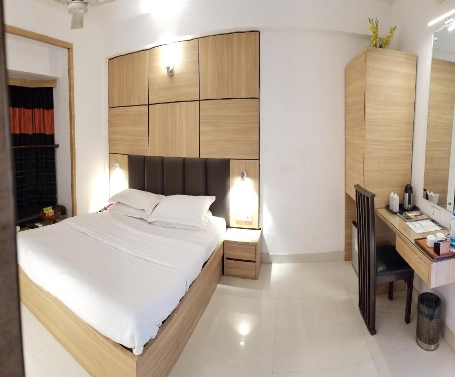 Postel nebo postele na pokoji v ubytování Roland Hotel