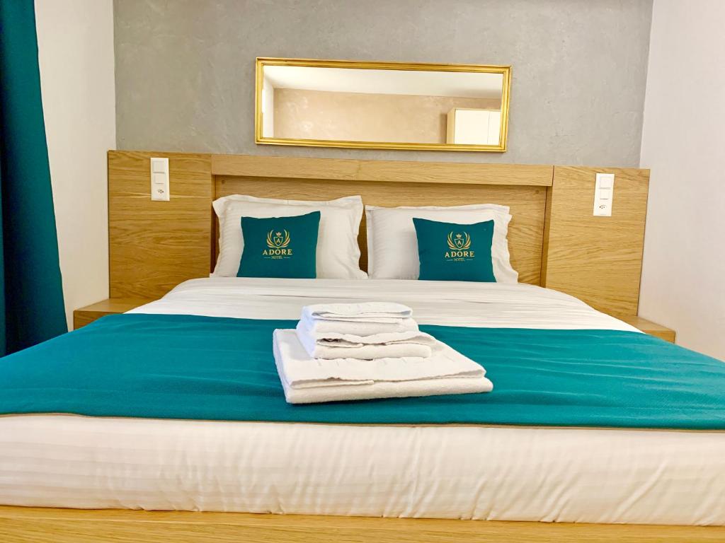 Postel nebo postele na pokoji v ubytování Hotel Adore