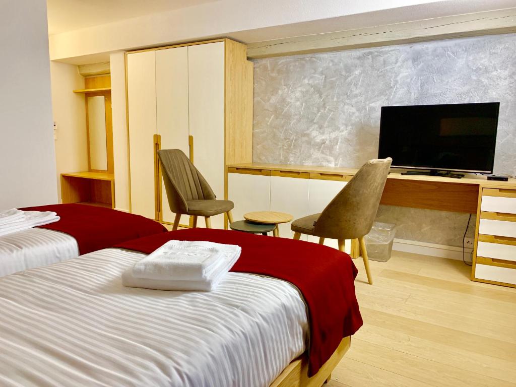 Postel nebo postele na pokoji v ubytování Hotel Adore