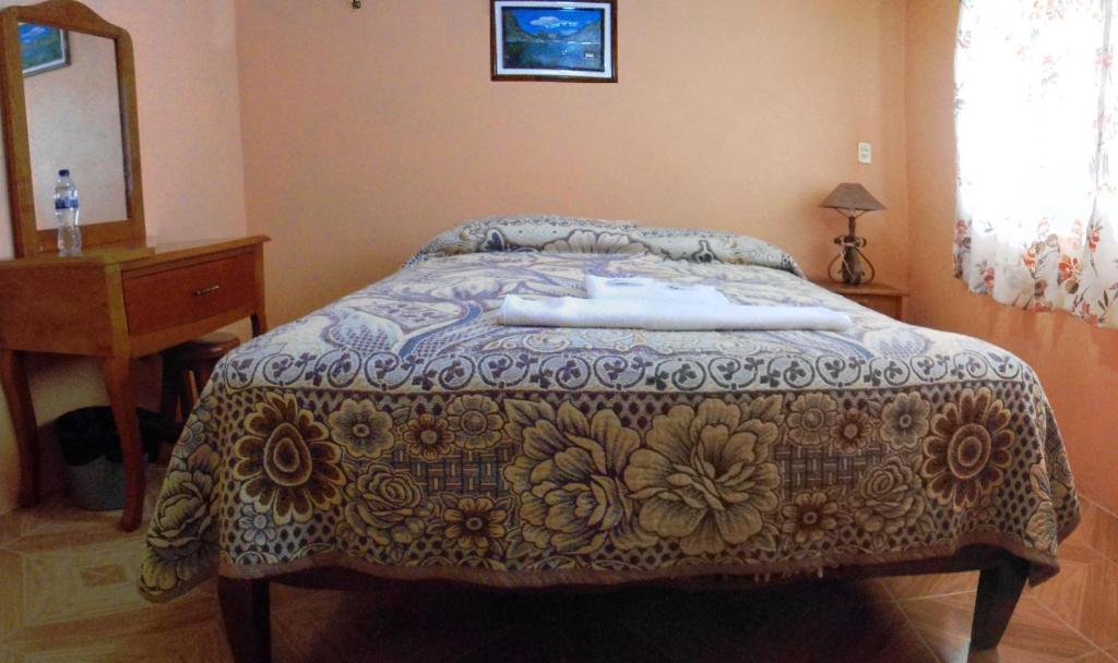 Postel nebo postele na pokoji v ubytování Posada Dos Hermanos