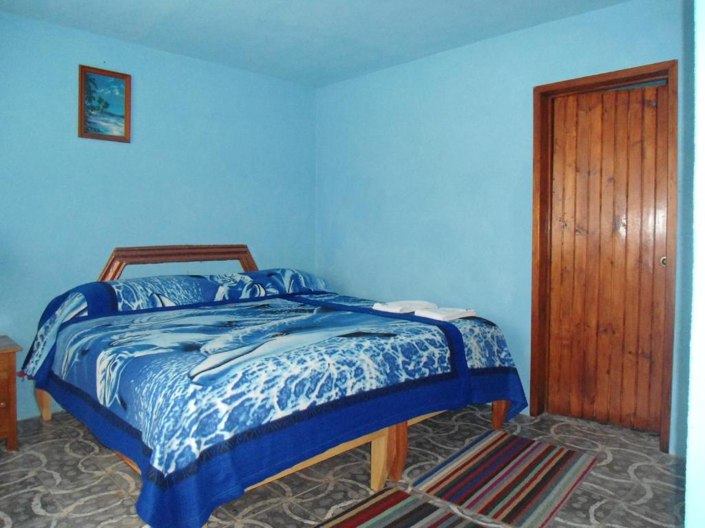 Postel nebo postele na pokoji v ubytování Posada Dos Hermanos