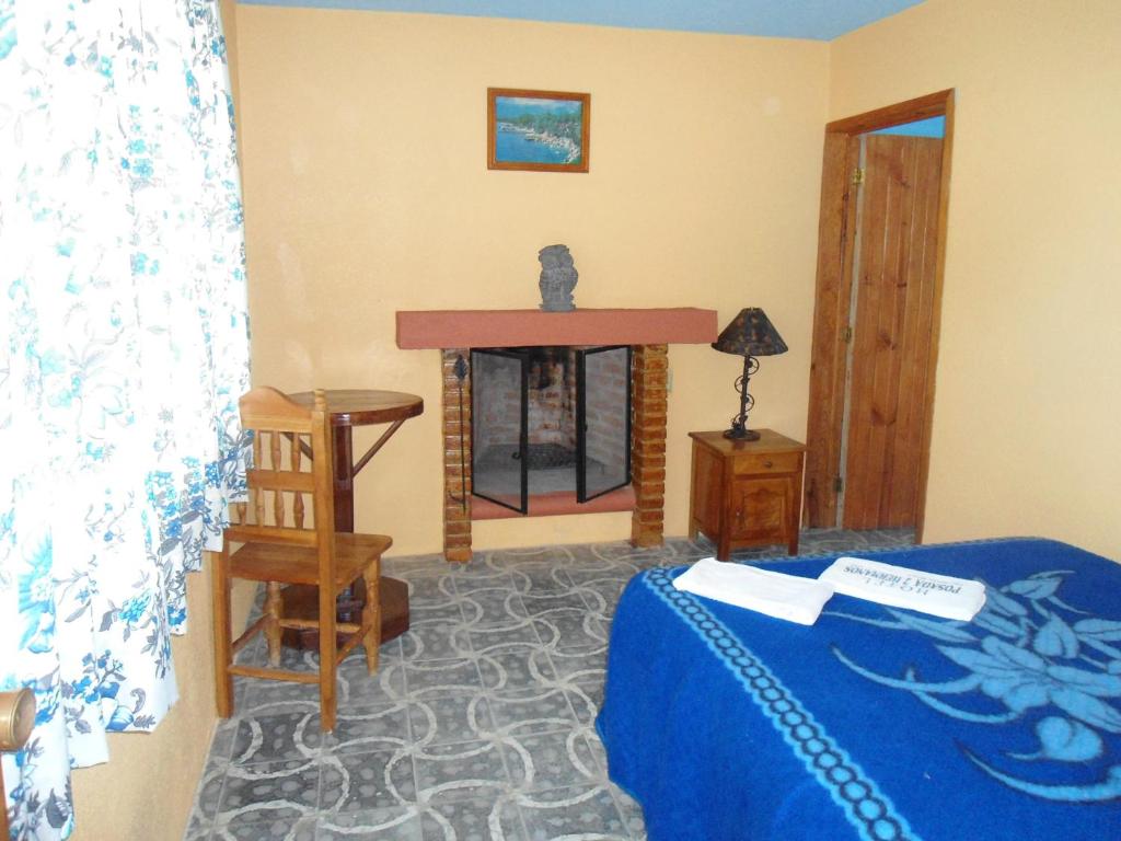 Postel nebo postele na pokoji v ubytování Posada Dos Hermanos