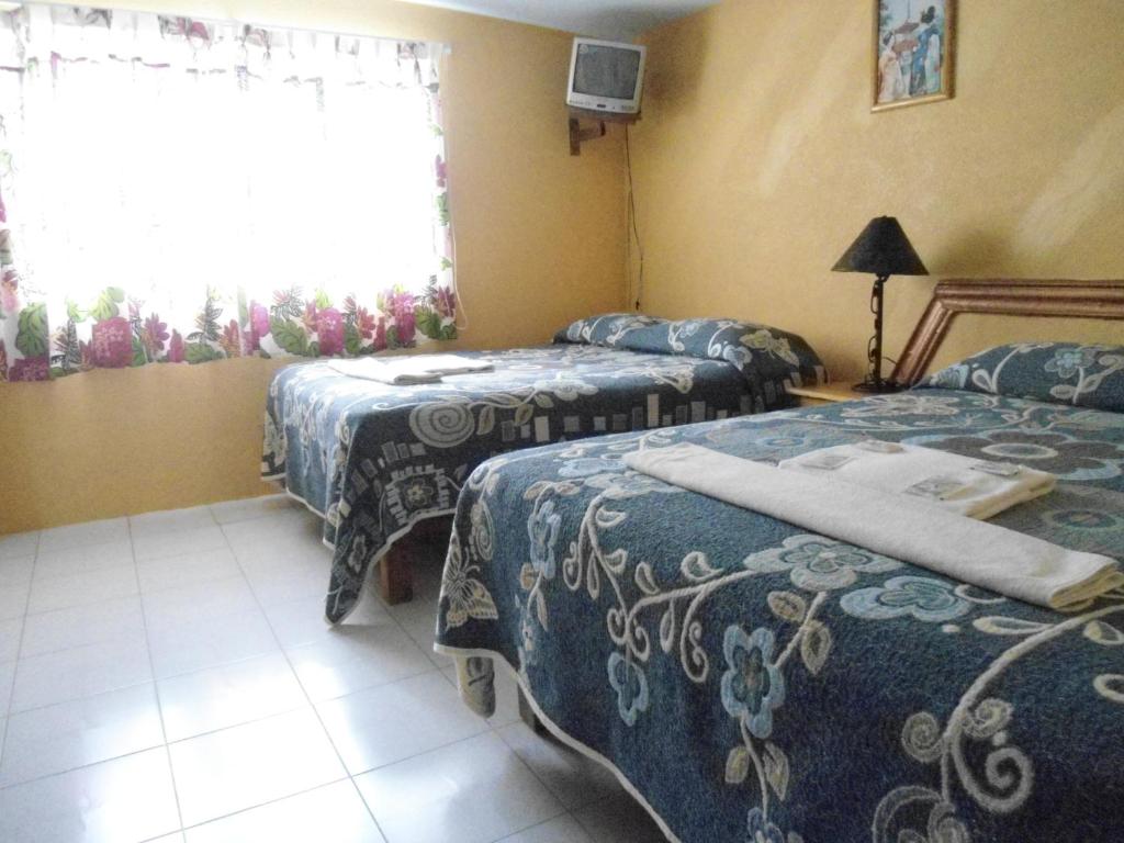 Postel nebo postele na pokoji v ubytování Posada Dos Hermanos
