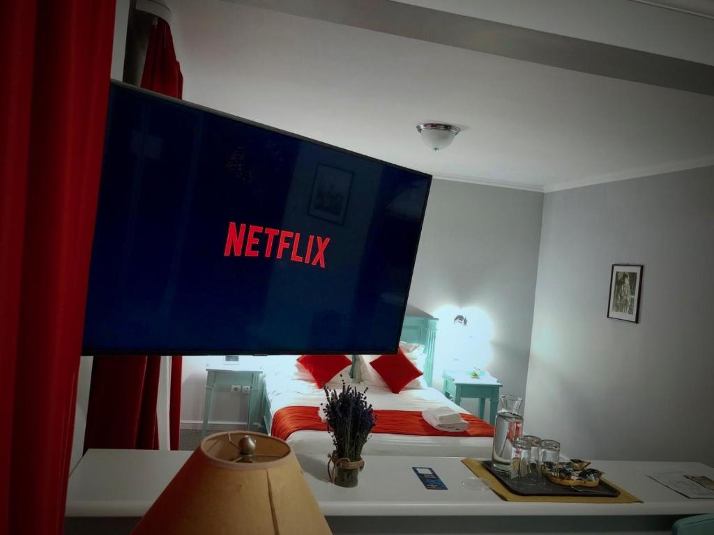 TV a/nebo společenská místnost v ubytování Vila De Argint Aleea Pelesului Nr 2