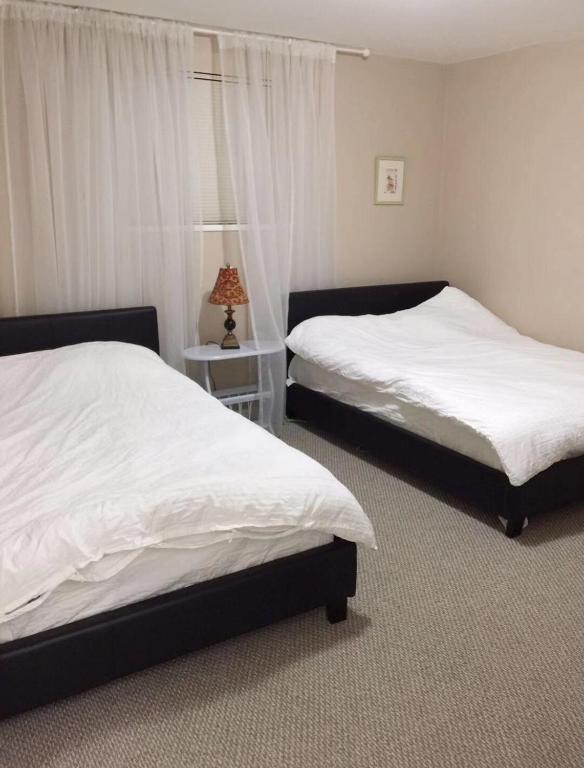 Postel nebo postele na pokoji v ubytování Brentwood Home