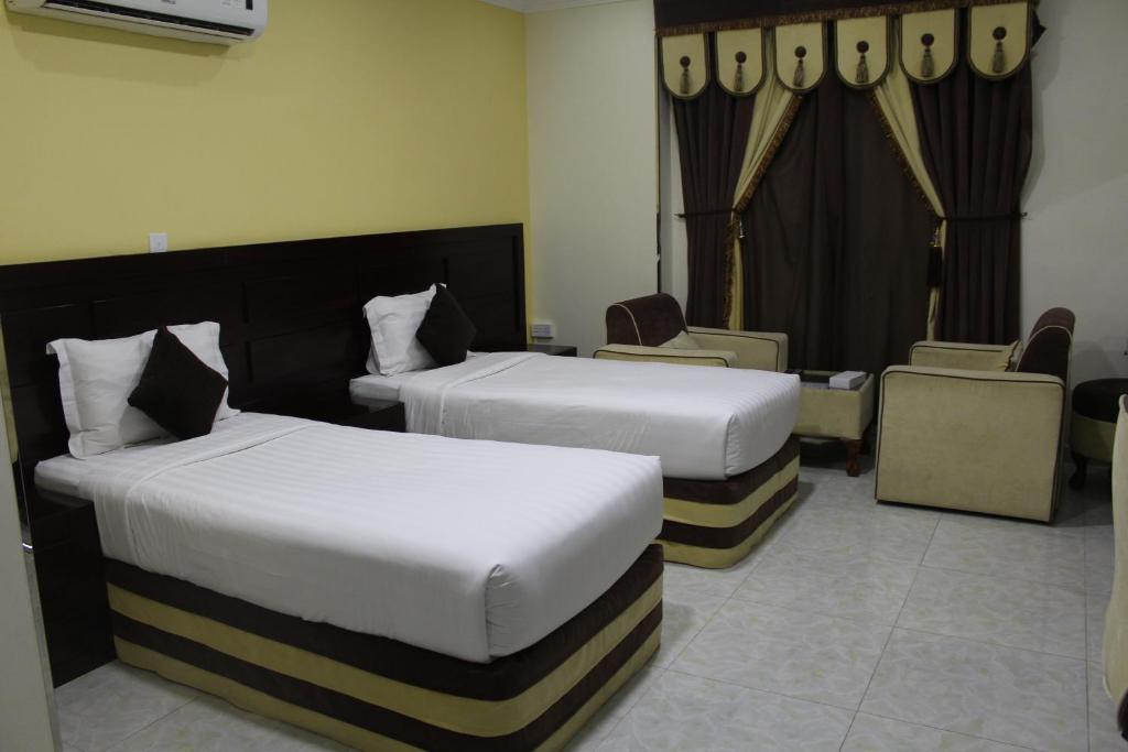 Postel nebo postele na pokoji v ubytování Alsafa Hotel