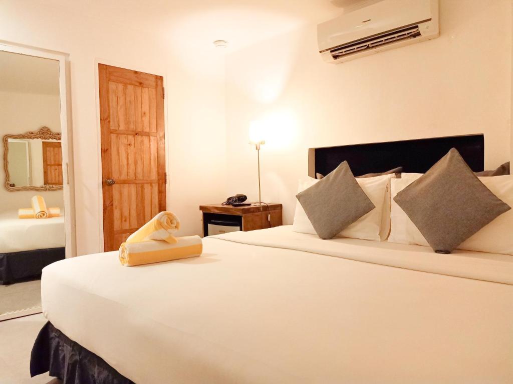 Postel nebo postele na pokoji v ubytování Zuzuni Boutique Hotel