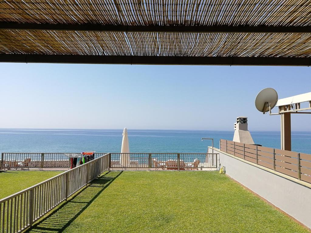 a balcony with a view of the ocean at Dip in the blue - 2 in Agios Georgios