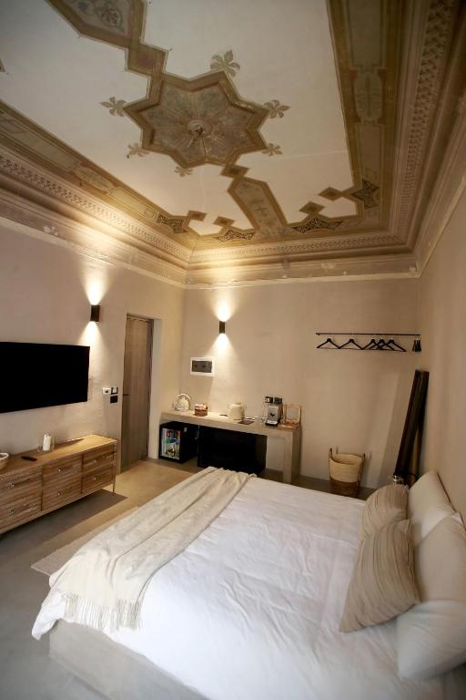 Postel nebo postele na pokoji v ubytování Casa Nostra Luxury Suites & Spa