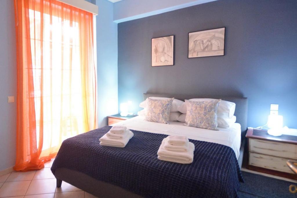 Ένα ή περισσότερα κρεβάτια σε δωμάτιο στο Andriannas apartment-parking lot included