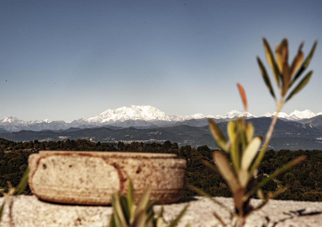 a view of a snow covered mountain in the distance at Hotel Locanda Dei Mai Intees in Azzate