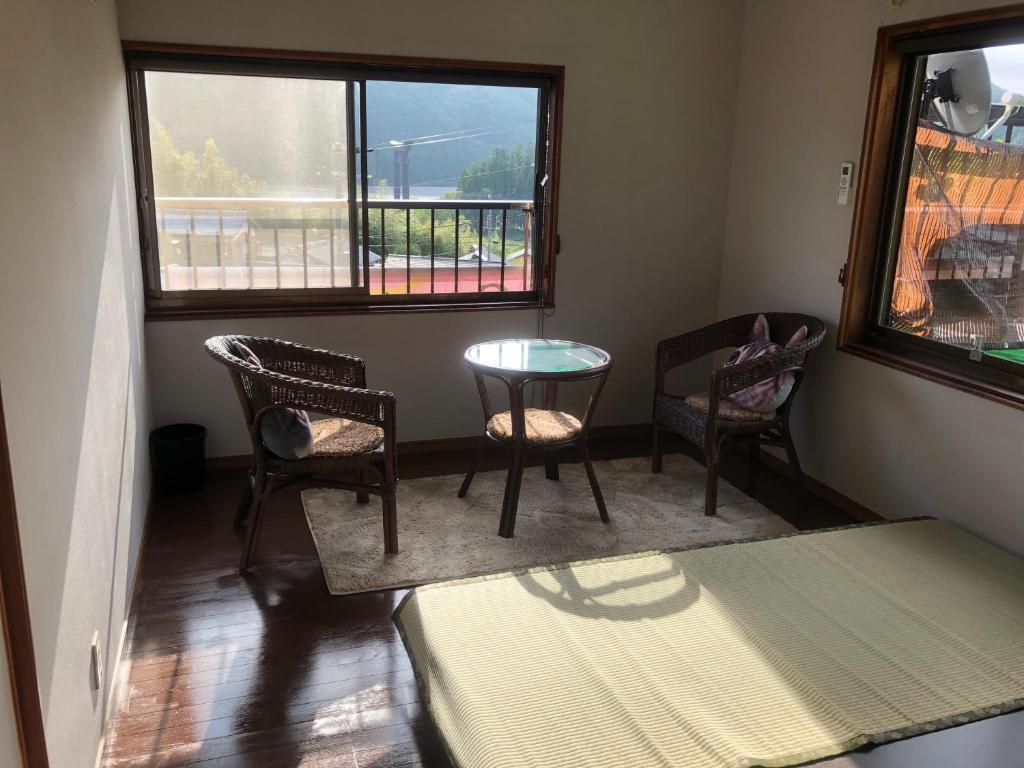 Postel nebo postele na pokoji v ubytování Guesthouse Yui