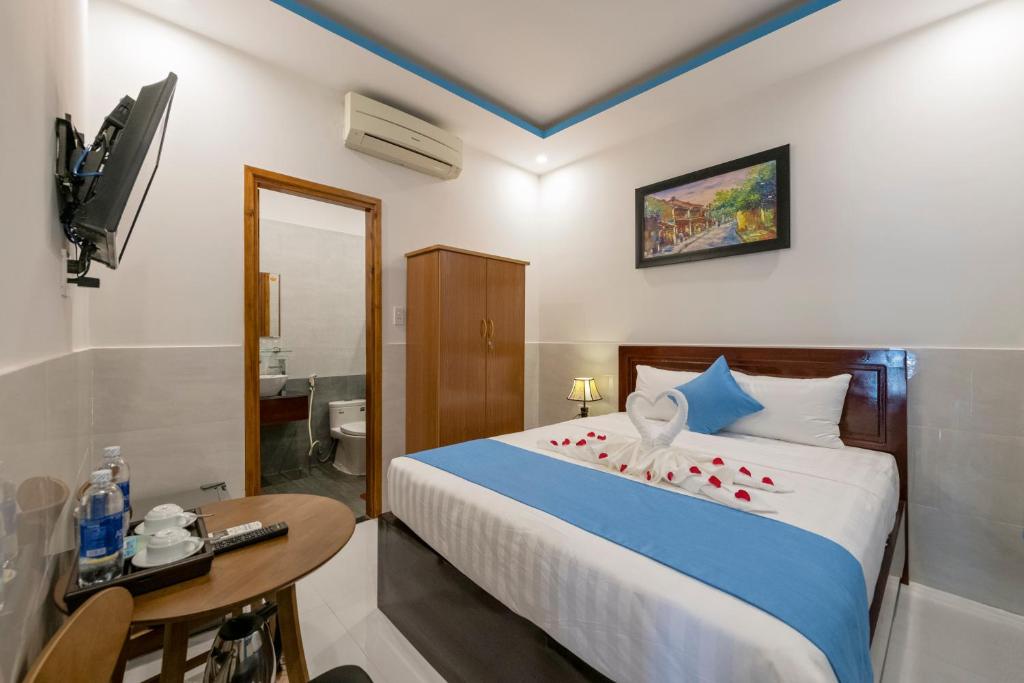 Postel nebo postele na pokoji v ubytování Hoi An Impression Homestay