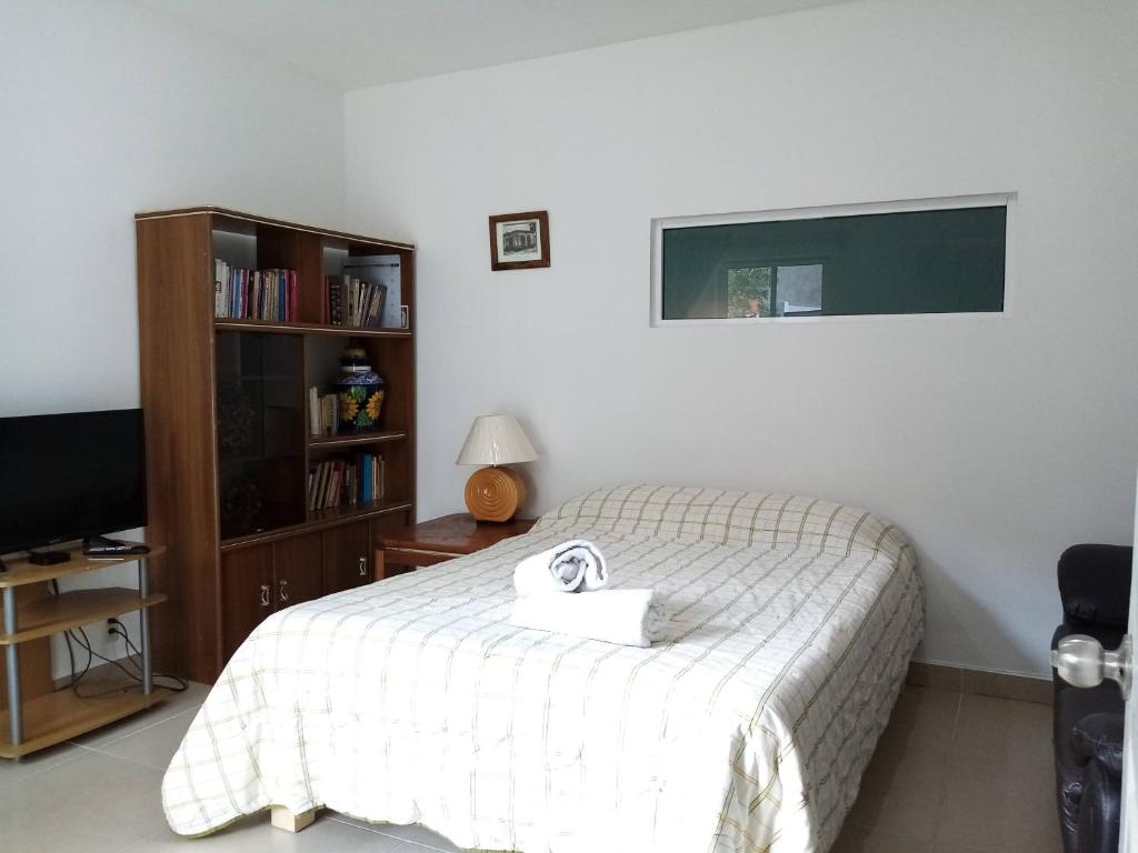 Postel nebo postele na pokoji v ubytování Milenio III B&B