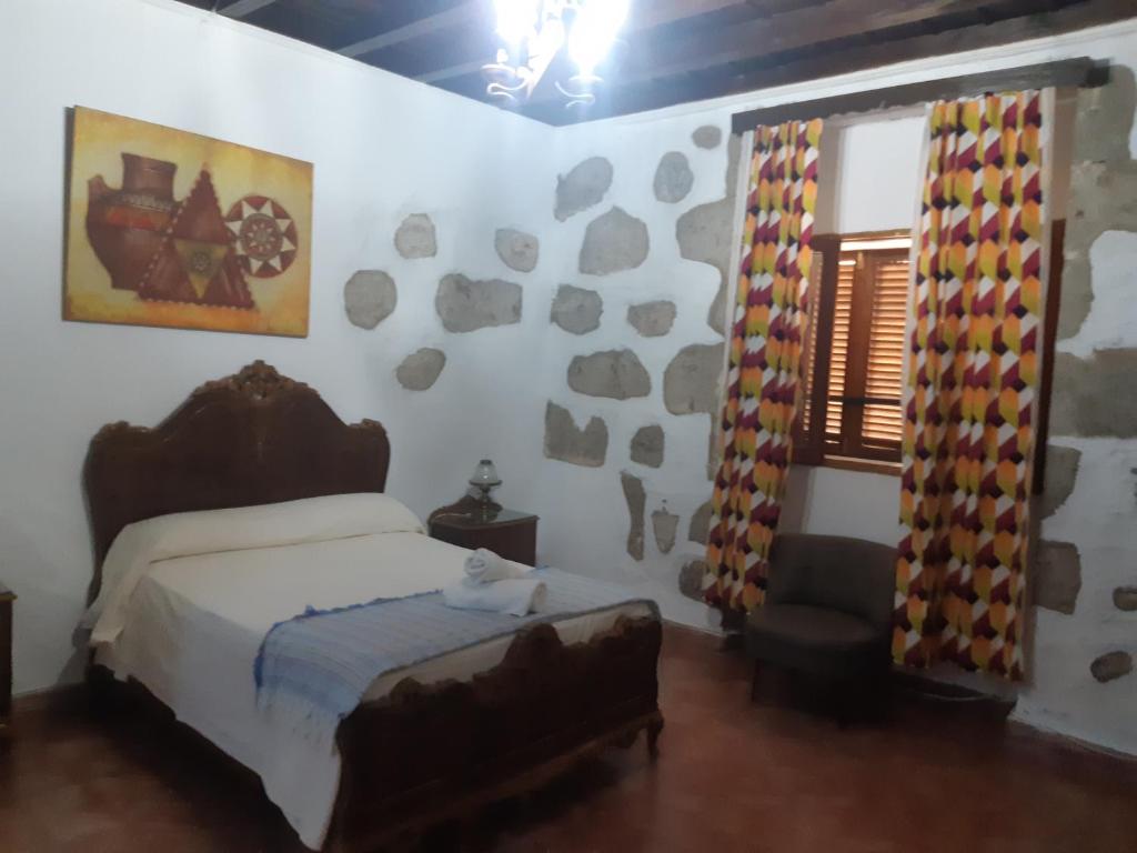 Postel nebo postele na pokoji v ubytování Casa rural el Burro